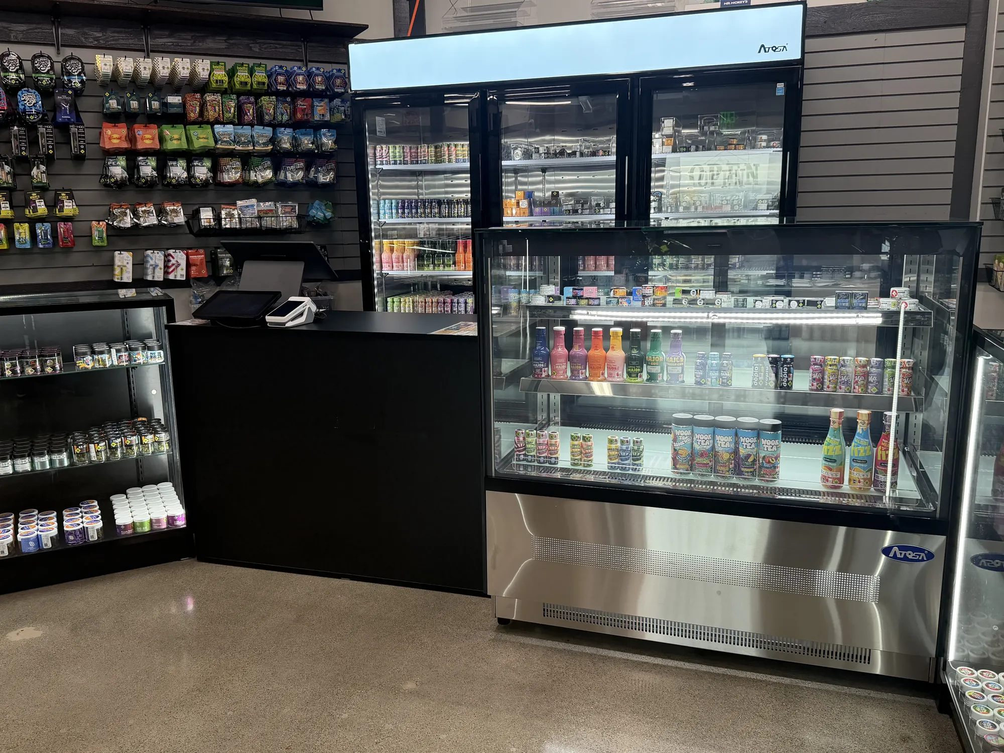 Drink coolers and a refrigerated display of cannabis beverages at Crystal Leaves