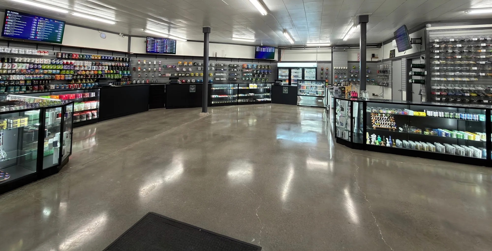 The whole Crystal Leaves sales floor seen from the front door, with glass display cases